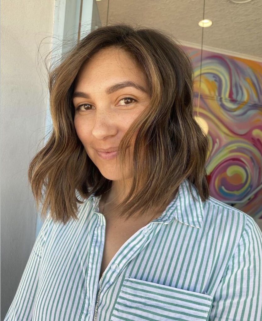 Half head of foils adding brightness through the top and sides of brunette hair