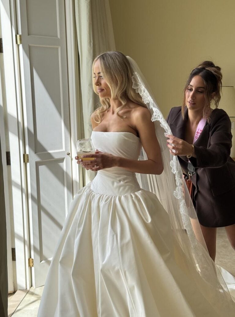 A Circles of Hair stylist finishing a bride's veil on the wedding morning