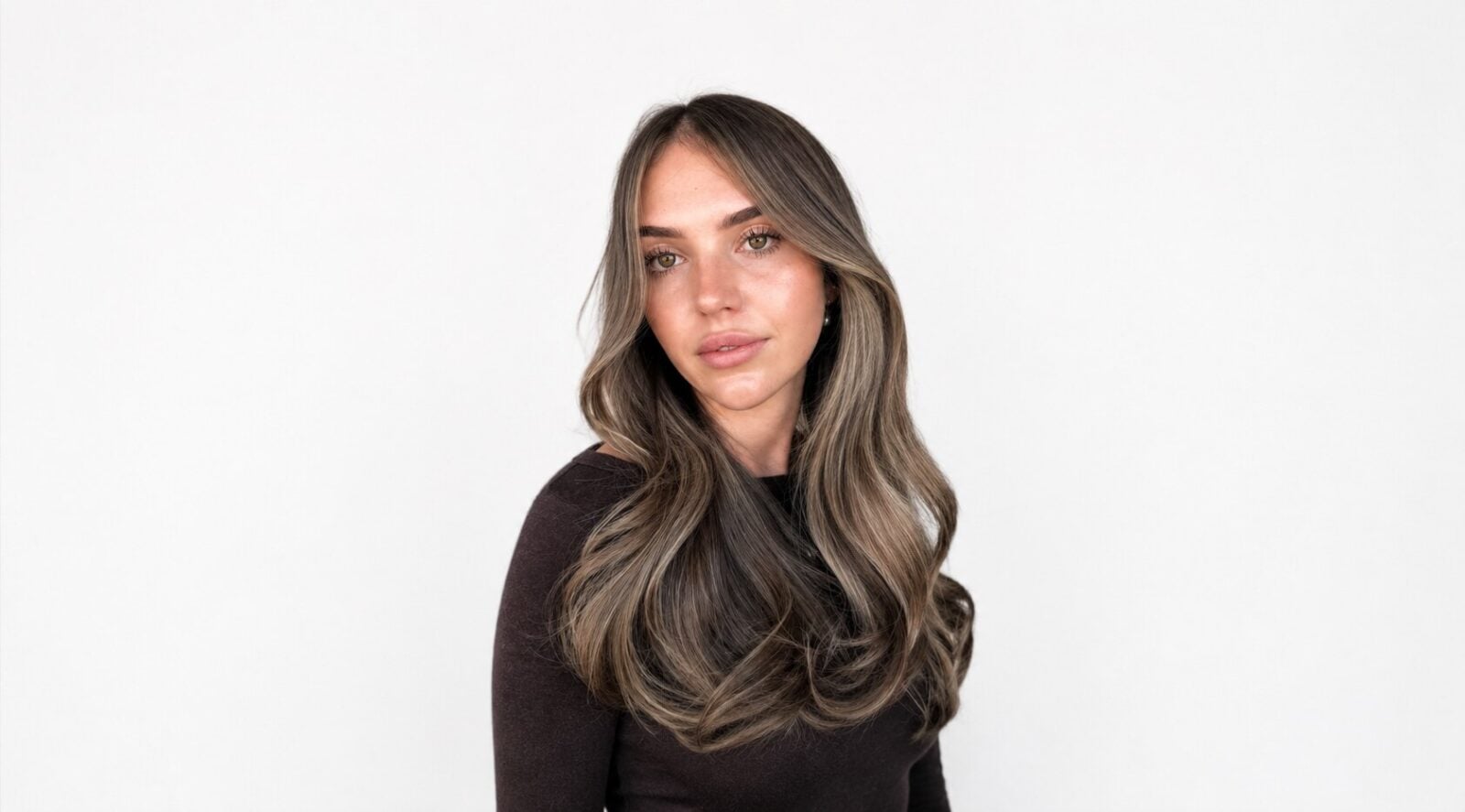 Half head of foils adding brightness through the top and sides of brunette hair