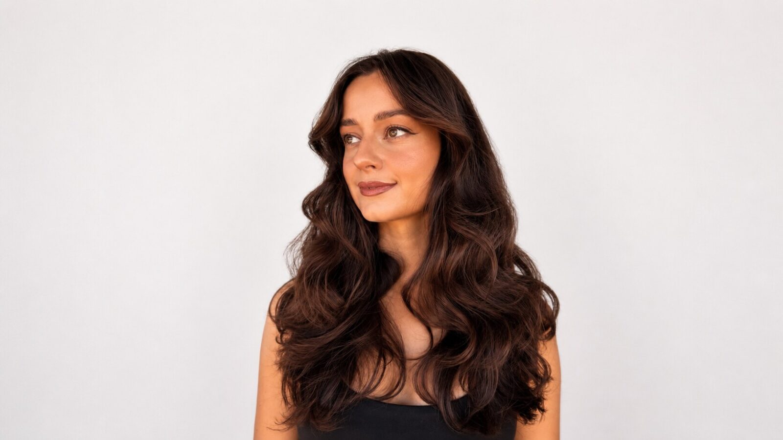 Circles signature waves created with a curling wand on long balayage hair, Perth
