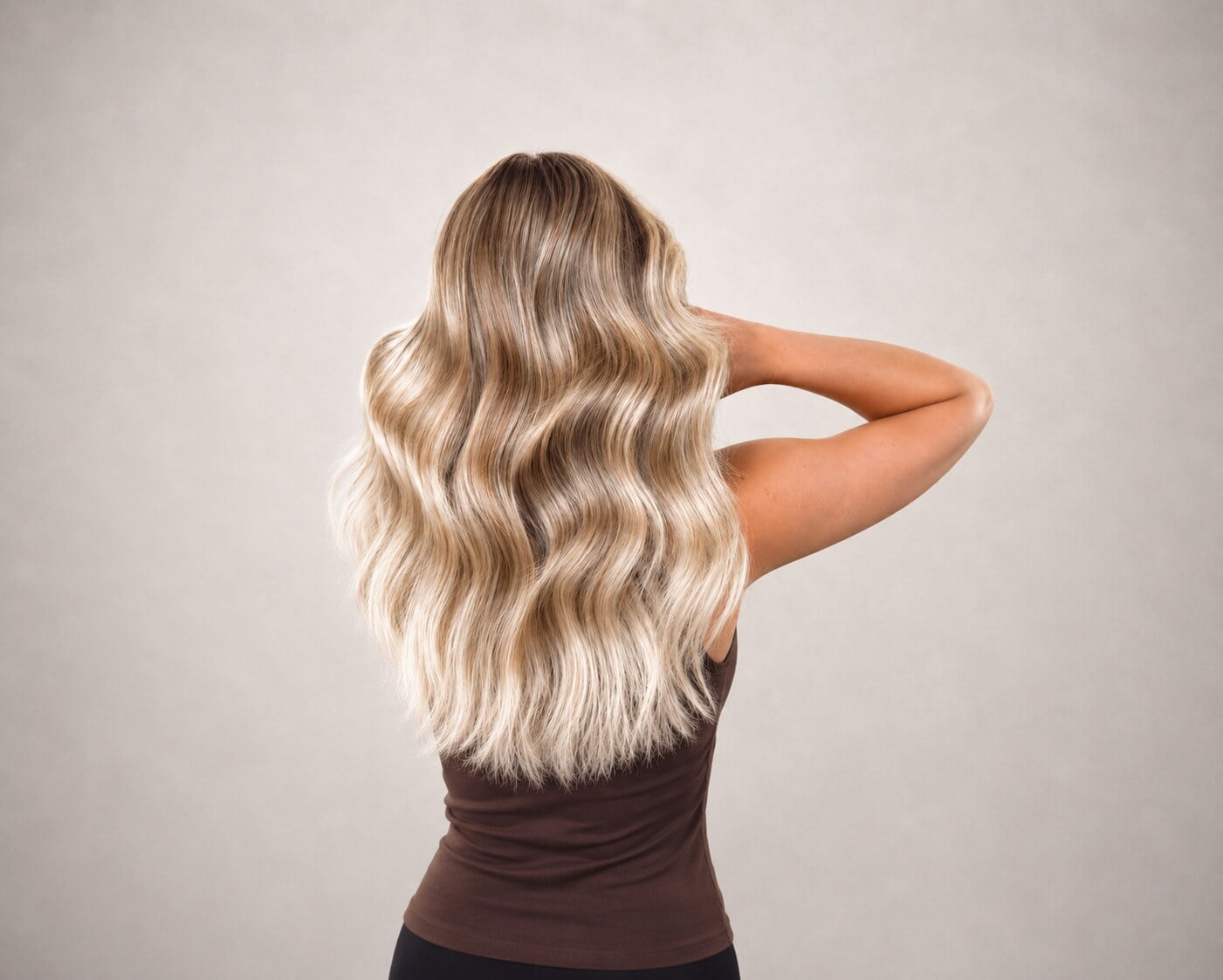 Hand-sewn weft hair extensions creating thick beachy blonde waves, Circles of Hair Perth