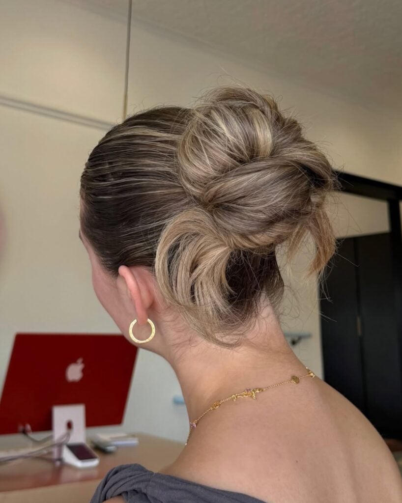 Knotted textured bun on bronde hair with gold hoops, by Circles of Hair Perth
